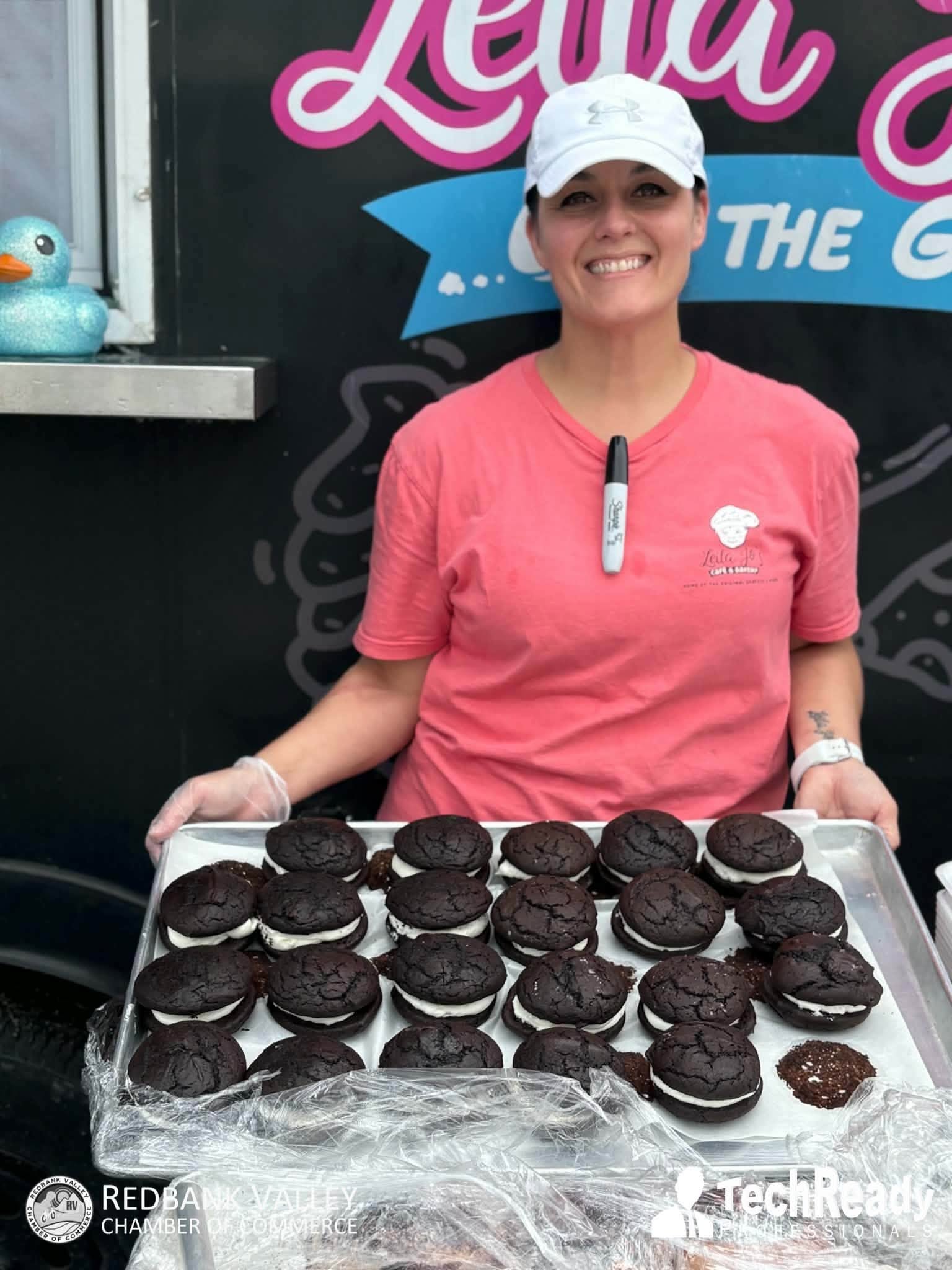 A Peanut Butter Festival food vendor displaying a tray of chocolate whoopie pies in 2026